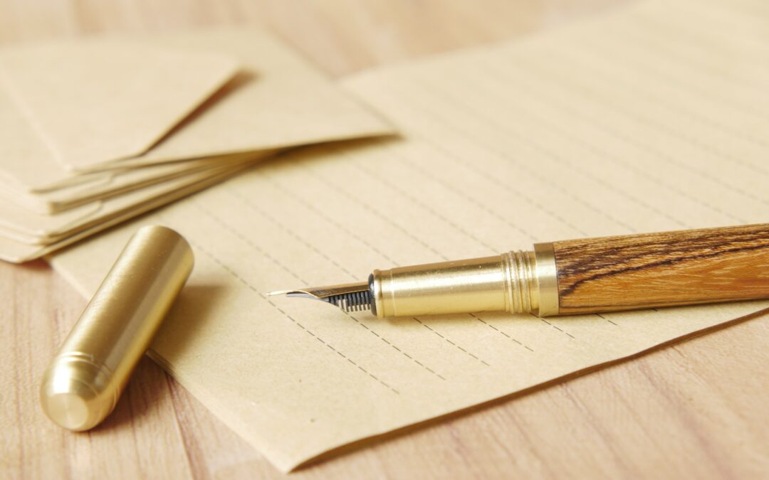A fountain pen is ready with a blank piece of paper